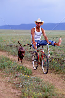 cowboy playing on bicycle