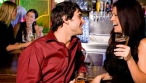 man and woman dating at a bar
